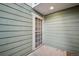 Private entrance showcasing a secure screen door and modern exterior design at 3400 S Eagle St # 104, Aurora, CO 80014