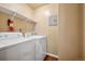 Functional laundry room equipped with modern washer and dryer at 3400 S Eagle St # 104, Aurora, CO 80014