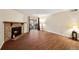 The bright living room features wood floors, a fireplace, and sliding door access to a patio at 3400 S Eagle St # 104, Aurora, CO 80014