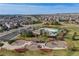 An elevated aerial view showcases a community pool, playground and parking at 13912 Ashgrove Cir, Parker, CO 80134