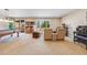 Basement with a pool table, piano, two recliners, and a door to the exterior at 13912 Ashgrove Cir, Parker, CO 80134