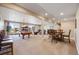 Finished basement with carpet, pool table, dining table and living room area at 13912 Ashgrove Cir, Parker, CO 80134