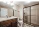 Bathroom features a large shower, toilet, and vanity with elegant countertop at 13912 Ashgrove Cir, Parker, CO 80134