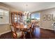 Elegant dining room features a beautiful chandelier, hardwood floors and access to the deck at 13912 Ashgrove Cir, Parker, CO 80134