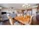 Inviting dining area adjacent to the living room with hardwood floors at 13912 Ashgrove Cir, Parker, CO 80134