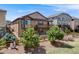 View of a two-story home from the backyard with a wooden deck and patio at 13912 Ashgrove Cir, Parker, CO 80134