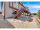 Exterior view featuring backyard access and landscaping with rock and stone accents at 13912 Ashgrove Cir, Parker, CO 80134