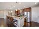 Gourmet kitchen featuring granite countertops, stainless steel appliances, and a breakfast bar at 13912 Ashgrove Cir, Parker, CO 80134