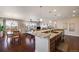 Bright, open kitchen with granite counters, modern appliances, and seamless flow to the dining and living areas at 13912 Ashgrove Cir, Parker, CO 80134