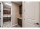 Convenient laundry room with ample storage and sink area at 13912 Ashgrove Cir, Parker, CO 80134