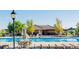 A view of the outdoor swimming pool with chairs and tables for community members at 13912 Ashgrove Cir, Parker, CO 80134
