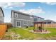 Spacious backyard with a patio, grill, pergola and well-manicured lawn at 715 N Amory St, Watkins, CO 80137