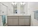 Bathroom features dual sinks, a shower with glass door and a towel rack at 715 N Amory St, Watkins, CO 80137
