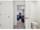 An ensuite bathroom leads into this bedroom showcasing great flow and functionality at 715 N Amory St, Watkins, CO 80137