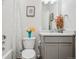 Bathroom features a bathtub with shower, vanity with sink, and a decorative mirror at 715 N Amory St, Watkins, CO 80137