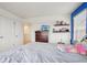 Cozy bedroom with walk-in closet, dresser, and comfortable bed at 715 N Amory St, Watkins, CO 80137