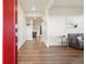Bright foyer with wood flooring, neutral walls, and an open view into the living area at 715 N Amory St, Watkins, CO 80137