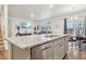 Bright and modern kitchen with a large island, stainless steel appliances, and open layout at 715 N Amory St, Watkins, CO 80137