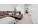 Comfortable living room featuring a sectional sofa and neutral decor at 715 N Amory St, Watkins, CO 80137