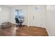A view of the office area reveals a wooden floor, desk, and well-lit space at 715 N Amory St, Watkins, CO 80137