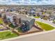 Beautiful aerial view of a two-story home with a fenced backyard, landscaping, and neighborhood at 880 Mcmurdo Cir, Castle Rock, CO 80108