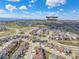 A beautiful aerial view of a neighborhood with houses and well-maintained streets and a view of Sage Canyon Elementary at 880 Mcmurdo Cir, Castle Rock, CO 80108