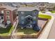 Aerial view of fenced backyard with new home construction in neighborhood at 880 Mcmurdo Cir, Castle Rock, CO 80108