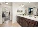 Bathroom with a double vanity sink and plenty of natural light at 880 Mcmurdo Cir, Castle Rock, CO 80108