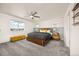 Bedroom with a large window and grey carpet at 880 Mcmurdo Cir, Castle Rock, CO 80108