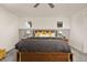 Bedroom with a wooden headboard and grey carpet at 880 Mcmurdo Cir, Castle Rock, CO 80108