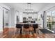 Dining room boasts an oversized table, modern lighting, and deck access at 880 Mcmurdo Cir, Castle Rock, CO 80108