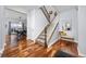Bright entryway with hardwood floors, a staircase, and views to the dining room. A welcoming feel at 880 Mcmurdo Cir, Castle Rock, CO 80108