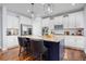 Island kitchen features granite countertops, stainless appliances, and custom cabinetry at 880 Mcmurdo Cir, Castle Rock, CO 80108