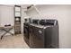 Convenient laundry room with modern washer and dryer at 880 Mcmurdo Cir, Castle Rock, CO 80108