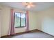 Airy bedroom with soft carpet, a ceiling fan, and a window with peaceful outdoor views at 30839 Manitoba Dr, Evergreen, CO 80439