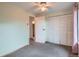 Spacious bedroom boasts plush carpeting, a ceiling fan, and a sizable closet for ample storage at 30839 Manitoba Dr, Evergreen, CO 80439