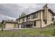 Exterior view featuring an attached garage and well-maintained lawn at 30839 Manitoba Dr, Evergreen, CO 80439