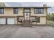 Charming exterior view featuring the front entrance and a two car garage at 30839 Manitoba Dr, Evergreen, CO 80439