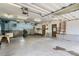 Spacious garage with concrete floors, ample lighting, and functional features perfect for projects and storage at 30839 Manitoba Dr, Evergreen, CO 80439