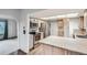 Bright eat-in kitchen with stainless appliances, a tile counter and adjacent to a living area at 30839 Manitoba Dr, Evergreen, CO 80439