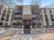 Multi-story condo building with well-maintained landscaping, inviting entrance, and multiple windows for natural light at 6930 E Girard Ave # 304, Denver, CO 80224