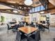Game room boasts a vaulted ceiling, pool tables, and tables with chairs at 6930 E Girard Ave # 304, Denver, CO 80224