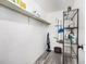 Storage room featuring laminate floors, ample shelf space, and cleaning supplies at 6930 E Girard Ave # 304, Denver, CO 80224