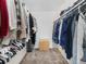 Spacious walk-in closet with clothing racks on both sides and a wicker basket at 6930 E Girard Ave # 304, Denver, CO 80224