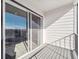 Private balcony showcasing sliding glass doors and a protective railing, perfect for enjoying outdoor views at 487 Interlocken Blvd # 410, Broomfield, CO 80021