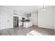 A modern kitchen is complete with stainless steel appliances, white cabinets, and an island at 487 Interlocken Blvd # 410, Broomfield, CO 80021