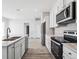 Stylish kitchen featuring stainless appliances, island with seating and open floor plan at 487 Interlocken Blvd # 410, Broomfield, CO 80021