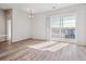 Bright living room with modern flooring and sliding glass doors to the balcony at 487 Interlocken Blvd # 410, Broomfield, CO 80021