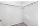 Efficient walk-in closet designed with shelving, rod for organizing apparel and optimizing space at 487 Interlocken Blvd # 410, Broomfield, CO 80021