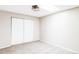 Empty bedroom with carpeted floors, bi-fold closet doors, and a neutral color scheme at 5300 E Cherry Creek South Dr # 620, Denver, CO 80246